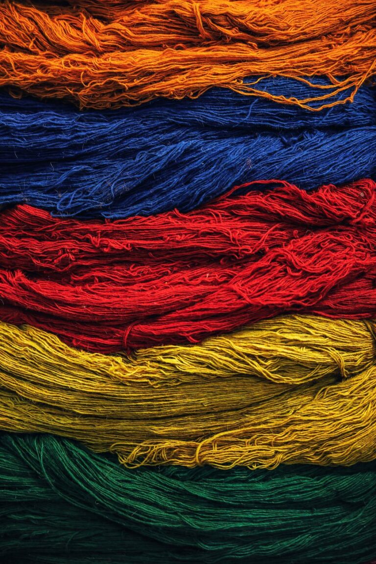 close up shot of threads with assorted colors